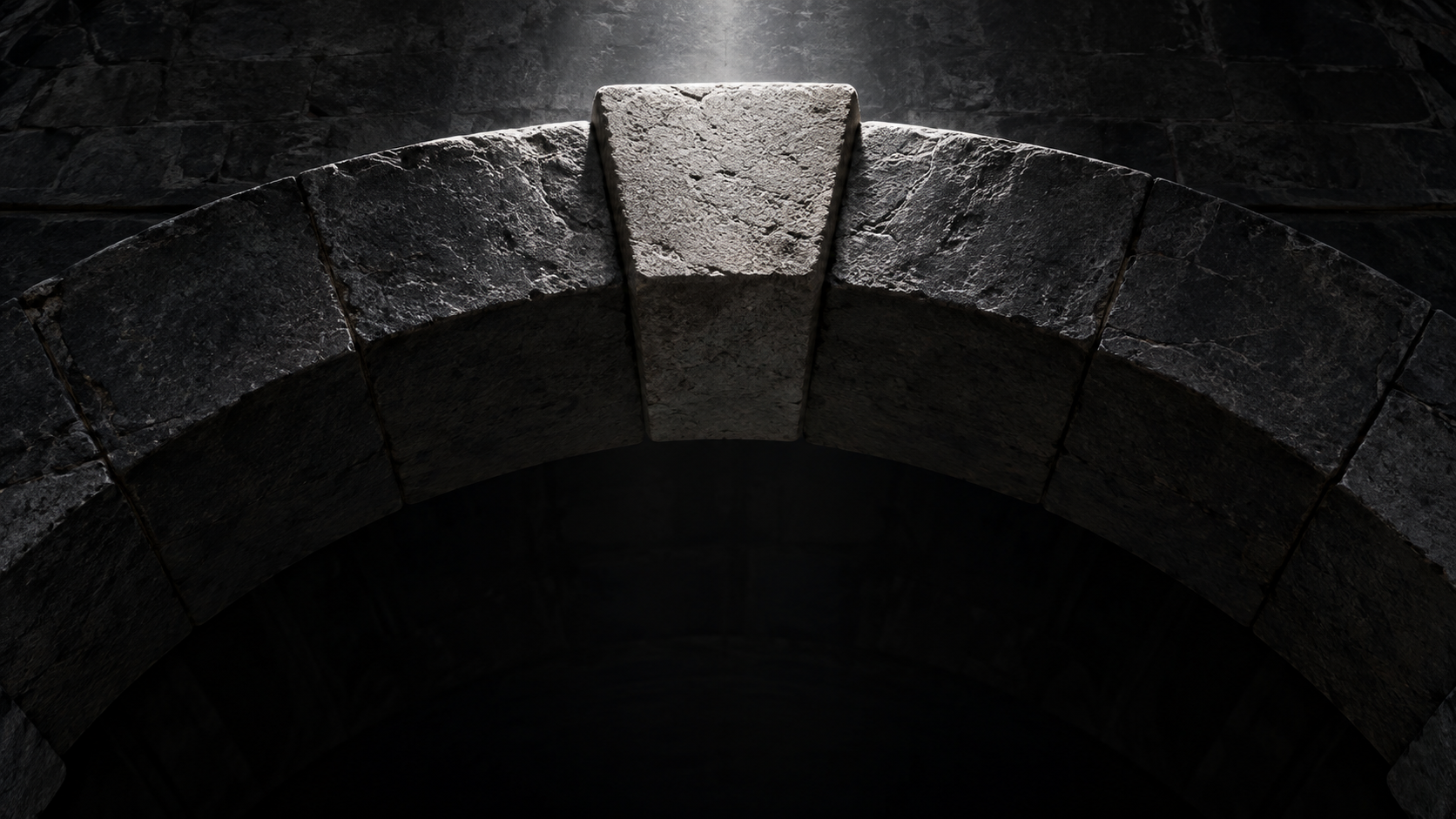 A stone arch with its keystone.